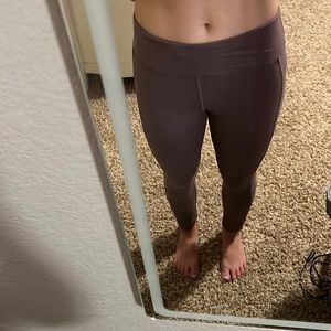 AMAZON PURPLE LEGGINGS. MESH IS ON THE SIDE OF EACH LEG.